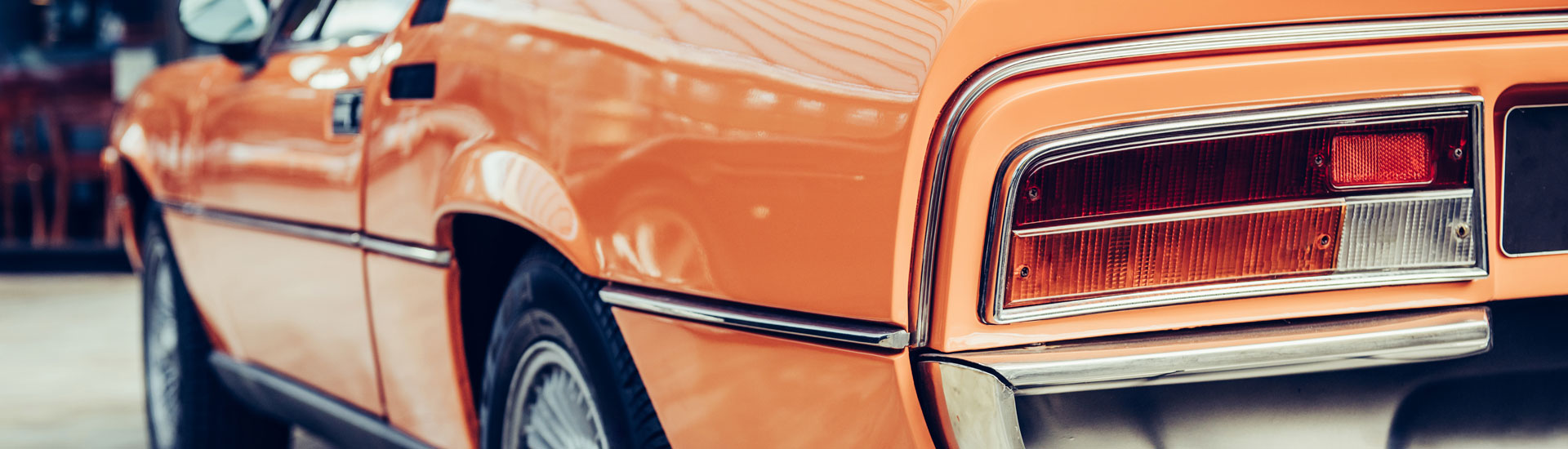 Rear Side View of a Orange Car